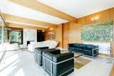 Living Room, Coffee Tables, Sofa, End Tables, Ottomans, Standard Layout Fireplace, Sectional, Chair, Rug Floor, and Wall Lighting  Photos from A Modernist Time Capsule by Erno Goldfinger Asks $4M