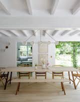 Dining Room, Pendant Lighting, Table, Chair, Bench, Wall Lighting, and Light Hardwood Floor  Photos from A Hamptons Beach Retreat Gets a Scandinavian-Style Makeover