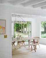 Dining Room, Light Hardwood Floor, Chair, Bench, Table, and Pendant Lighting  Photo 4 of 19 in A Hamptons Beach Retreat Gets a Scandinavian-Style Makeover