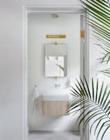 Bath Room, Wall Mount Sink, Wall Lighting, and Ceiling Lighting  Search “bathsinks--wall-mount” from A Hamptons Beach Retreat Gets a Scandinavian-Style Makeover
