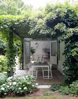 Outdoor, Shrubs, Flowers, Trees, Back Yard, Walkways, Wood Patio, Porch, Deck, Grass, Gardens, and Garden  Photo 1 of 362 in Vacation Home - Summer by Neiva Desrochers from A Hamptons Beach Retreat Gets a Scandinavian-Style Makeover