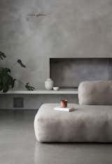 Living Room, Concrete Floor, Standard Layout Fireplace, Sofa, and Bench  Photo 6 of 18 in A Cubic Dwelling in Norway Just Oozes Hygge