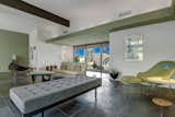 The entire living, dining, and entry area features dark slate flooring.