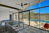 A bonus area overlooks the pool and is currently being used as a game room.&nbsp;