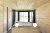 Bedroom, Table Lighting, Light Hardwood Floor, Bed, and Recessed Lighting The minimalist interiors of the suites.  Photo 9 of 13 in Drift Off in a Prefab Cabin at This Floating Hotel in France