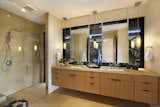 Bath Room, Drop In Sink, Enclosed Shower, Travertine Floor, and Granite Counter T  Photo 6 of 14 in A Breezy Hawaiian Residence by Olson Kundig Hits the Market at $6.95M