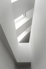 Skylights flood the staircase in natural daylight and increases the sense of height in the house.&nbsp;