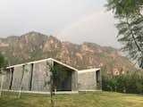 Exterior, House Building Type, Butterfly RoofLine, and Stone Siding Material The design reinforces the beauty of the site and the power of nature.  Photos from A Commanding Mexican Home of Stone and Concrete Is For Sale