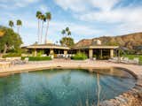 Outdoor, Shrubs, Large Patio, Porch, Deck, Trees, Back Yard, Desert, Swimming Pools, Tubs, Shower, and Grass T  Photo 16 of 19 in Own William Krisel's Palm Springs Pod House For $2.5M