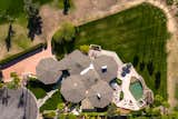 Exterior, Shingles Roof Material, House Building Type, and Mid-Century Building Type An arial view of the property clearly illustrates the five attached pods.  Photo 17 of 19 in Own William Krisel's Palm Springs Pod House For $2.5M