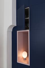 Additional storage is everywhere.  Menu JWDA Concrete Table Lamp from Before & After: An Ancient Barcelona Apartment Gets a Colorful, Chic Makeover