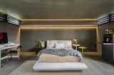 In one of the more unusual bedroom lighting ideas for the ceiling that we’ve seen, a dramatic backlight illuminates the wall and part of the ceiling in this otherwise dark bedroom.&nbsp; &nbsp;&nbsp;