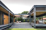 The terrace attaches to the main structure via a covered walkway.  Photo 3 of 10 in This Modern Prefab Is Now a Gorgeous Guest House