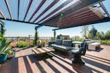 Outdoor, Wood, Metal, Decking, Rooftop, Planters, Horizontal, and Raised Planters The cantilevered flating Managris wood deck.  Outdoor Horizontal Rooftop Wood Photos from A Renovated Harry Gesner–Designed Midcentury in L.A. Wants $9.4M