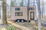 The Mohican tiny home has a starting price of $62,000, and it’s made by Amish craftsmen in Ohio. The 20' tiny home, which can be built in as little as eight weeks, has an unfinished exterior and a light and bright, minimalist interior that packs all the essentials into a compact footprint.