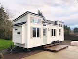 The recently completed Coastal Craftsman from the Oregon-based Handcrafted is now for sale and priced at $72,500. Built on a 28' x 8.5' triple axel Iron Eagle PAD trailer, the minimalist interiors include a lofted sleeping area and a sofa that transforms into bed for an additional sleeping area.