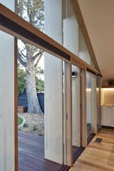 Doors, Wood, Swing Door Type, and Exterior The wood was simply stained and left in its natural state, and reduced the need for more costly structural steel.  Photo 5 of 12 in A Contemporary Extension Gives This Australian Home a New Face