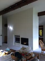 Before: The fireplace covered in drywall.