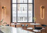 Dining Room, Table, Bar, Wall Lighting, and Chair Bespoke design elements also includes  sculptural wall pieces in brass and patinated metal  Photo 4 of 8 in A Historic London Property Is Converted Into a Modern Mediterranean Eatery