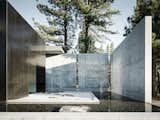 Large concrete walls provide both privacy and shade.