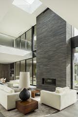 The space is anchored by the brick-inlay, indoor/outdoor fireplace.