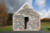 Exterior, Shingles Roof Material, Stone Siding Material, Farmhouse Building Type, Gable RoofLine, and House Building Type Vestigial stone walls that remain throughout the property, almost echoing the home's poetic use of stone.  Photo 2 of 13 in A Minimalist, Rick Joy–Designed Farmhouse in Vermont Asks $9.25M