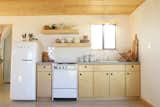 For their DIY petite open kitchen, Kathrin and Brian Smirke designed the cabinets and had the boxes and doors made at a small cabinet shop in L.A. They also formed and poured the concrete countertops themselves and constructed the floating shelves with leftover clear pine and plywood.&nbsp; &nbsp;