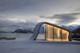 Exterior, Curved RoofLine, Glass Siding Material, and Concrete Siding Material The smoothness of the poured concrete is strikingly juxtaposed against the rugged surrounding terrain.  Photos from This Concrete Rest Stop Will Make You Want to Visit Norway