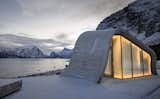 Exterior, Curved RoofLine, Glass Siding Material, and Concrete Siding Material The wave-shaped structure glows from within.  Photos from This Concrete Rest Stop Will Make You Want to Visit Norway