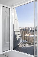 Windows A small balcony reveals stunning views of the city.  Photo 12 of 12 in This Tiny Home in Paris Unfolds Like a Children's Pop-Up Book