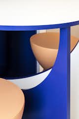 A detail of the brilliantly colored table and stools.&nbsp;