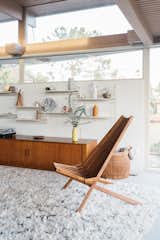 Living Room, Shelves, Storage, Chair, Rug Floor, Console Tables, and Carpet Floor Details of the living room.  Photos from Own a Charismatic L.A. Midcentury Designed by Rudolph Schindler For $1.8M