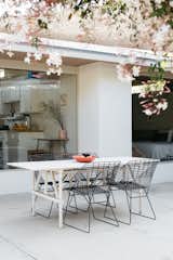 Outdoor, Back Yard, Small Patio, Porch, Deck, Flowers, and Concrete Patio, Porch, Deck The home truely celebrates Californian indoor/outdoor living.  Photos from 16 Flower Arrangements to Inspire Your Romantic Side This Valentine’s Day