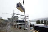 Exterior and Prefab Building Type  A room module being lowered into place. 

  Photo 12 of 13 in This Hotel in the Swiss Alps Is Made Up of 96 Prefab Modules