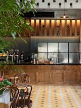 Here is a look at the 26-foot-long wood bar that displays the cafe’s "Ground Control" drip machine. The custom Slayer espresso machine and Espresso Grinders from Ceado E37k boast the slowest RPM on the market, a feature that prevents overheating.