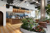 Dining, Chair, Cement Tile, Pendant, Bar, Wall, and Concrete The diverse material palette includes Colombian wood, concrete blocks, tiles, and stone.  Dining Wall Bar Pendant Photos from This New Brooklyn Cafe Is Brewing Up More Than Tasty Artisanal Coffee