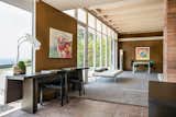 Living Room, Carpet Floor, Desk, Ottomans, Bench, Chair, Track Lighting, and Floor Lighting The tongue-and-groove beamed ceiling has been painte  Photos from Case Study House #18 in L.A. Hits the Market at $10M and Includes Plans From Tom Kundig