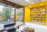 A floor-to-ceiling sliding door offers direct access to the patio and yard. A yellow custom-built reading nook packs a playful punch of bold color, and certainly brightens up the gray days that the Pacific Northwest is known for.&nbsp;