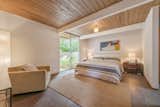 The master bedroom offers tremendous space, as well as a large floor-to-ceiling window.&nbsp;