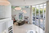 Living, Sofa, Pendant, Chair, Terrazzo, Coffee Tables, End Tables, Shelves, Floor, and Table The roundness of the house lends itself perfectly to an open, wallless floor plan. 

  Living Floor Terrazzo Table Photos from A Circular Midcentury Gem in Florida Hits the Market at $1M