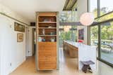 Kitchen, Pendant Lighting, Wood Cabinet, Laminate Counter, and Drop In Sink A built-in display cabinet adds storage, while also enhancing the authentic midcentury feel.  Photo 6 of 17 in Mad Men Producer Puts His Pasadena Midcentury Up For Auction Starting at $1.7M