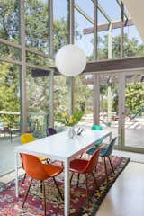 Dining Room, Table, Pendant Lighting, Chair, and Rug Floor Double-height ceilings over the open dining area helps to create a nice, airy vibe.  Photo 3 of 17 in Mad Men Producer Puts His Pasadena Midcentury Up For Auction Starting at $1.7M