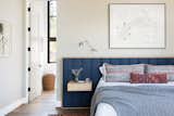 The custom built-in bed and bedside tables are from ABD Studio. The art above the bed was commissioned from James Surls. 
