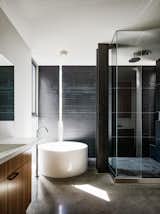 Texture, light, and a pureness of materiality turn the bathroom into a balanced composition.&nbsp;