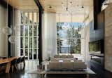 Living, Table, End Tables, Chair, Wood Burning, Standard Layout, Concrete, Sofa, Rug, Ceiling, Coffee Tables, and Pendant  Living Pendant Concrete Rug Chair Standard Layout Photos from An Uplifting Lake Tahoe Retreat Uses Light as a Building Material