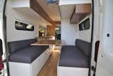The table in this converted van folds up and the banquettes can become a bed for two.&nbsp;
