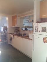 Here is a look at the kitchen before the renovation.

  Photo 5 of 21 in Before & After: A Century-Old Row House in Montreal Gets a Glorious Renovation