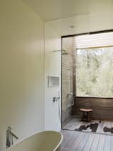 The master suite bathroom features an outdoor shower. 