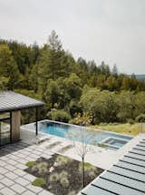 Outdoor, Trees, Large Patio, Porch, Deck, Gardens, Large Pools, Tubs, Shower, and Back Yard The poured concrete foundation is clearly visible when viewing the back of the home.  Photos from Fall Under the Spell of This Northern California Wine Country Retreat