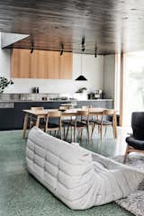 Dining Room, Track Lighting, Terrazzo Floor, Pendant Lighting, Chair, and Table Energy efficient glazing and sustainable timber selections have also been used throughout the project.  Photos from A Melbourne Home Gains a Gorgeous Glass-Fronted Addition